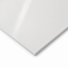 Glossy white sheet corner on white, light streaking across the polished face