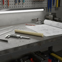 Cream natural cast nylon 6 rod on a workshop bench with callipers and a technical drawing
