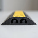 Cross section of the two channel cable cover showing both enclosed channels, each holding a cable
