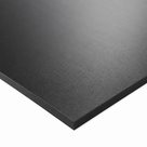 Close crop of a black polyethylene sheet corner on white, textured face and clean edge