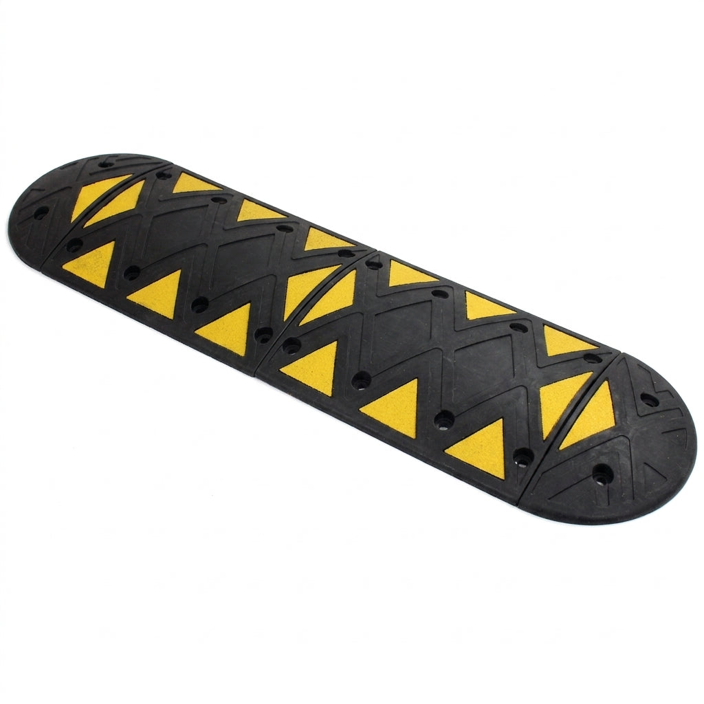Assembled rubber speed bump with yellow reflective triangles and rounded end caps