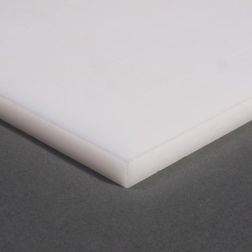 Angled corner of a white polypropylene slab against grey, matt face and clean cut edge