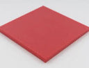 Small square of red polyethylene sheet on a white background, cut edge catching the light