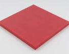 Small square of red polyethylene sheet on a white background, cut edge catching the light