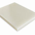 Off-white nylon slab angled on white, moderate sawn edge running across the front