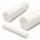 Three white acetal homopolymer rods in different diameters lying at angles on a white background