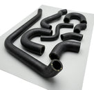 Full set of black moulded coolant hoses laid out for a Triumph Stag hose kit