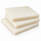 Three cream nylon sheets stacked squarely on a plain white background