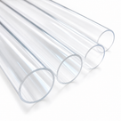 Three colourless clear acrylic tubes stacked at an angle, cut ends towards the camera, on a white studio background.