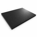 Black nylon sheet lying angled on white, textured matt surface and thick square edge