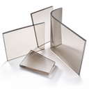 Four bronze-tinted polycarbonate panels standing and lying on white, thick polished edges