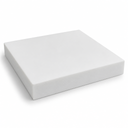 Thick square white PTFE slab on white, deep sawn edge running along the near sides