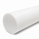 Close-up of a thick white PTFE rod lying diagonally on white, its smooth cut end facing the camera