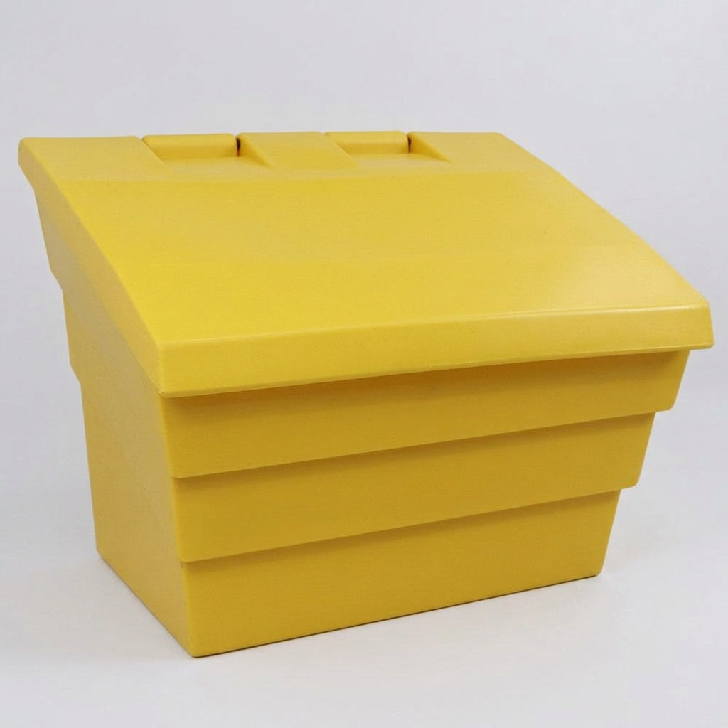 Yellow ribbed polyethylene grit bin with angled lid photographed on a plain grey background