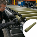Engineer fitting a khaki-green nylon roller into bearing blocks on a conveyor, inset of a rod