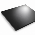 Thin square black polyethylene sheet on white, soft highlight across the matt face