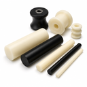 Cream and black nylon 66 rods in several diameters with turned pulleys and bushes, on white