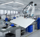 Large white PTFE sheet handled by a robot arm in a bright production facility