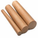 Three brown phenolic cotton rods stacked at an angle on white, sawn ends showing the fabric grain