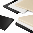 Four-panel studio grid of black, white and beige polypropylene sheets, square sawn edges to the front