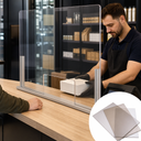 Clear screen barrier on a shop counter as a staff member passes a box across, inset tinted sheets