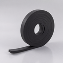 Deep coil of black rubber strip on a light grey background, open core and a square-ended tail in front