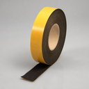Roll of thin black sponge rubber strip with yellow adhesive liner on the outer face and tail hanging free
