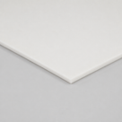Corner of a white silicone sheet on a pale grey ground, thin square edge along the near side