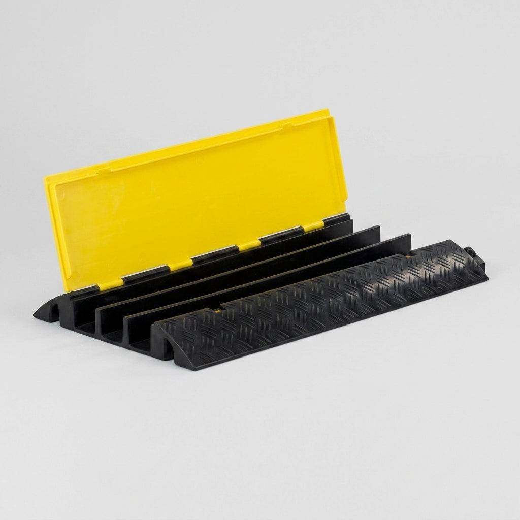 Three channel rubber cable protector ramp with the yellow hinged lid open showing the empty cable channels