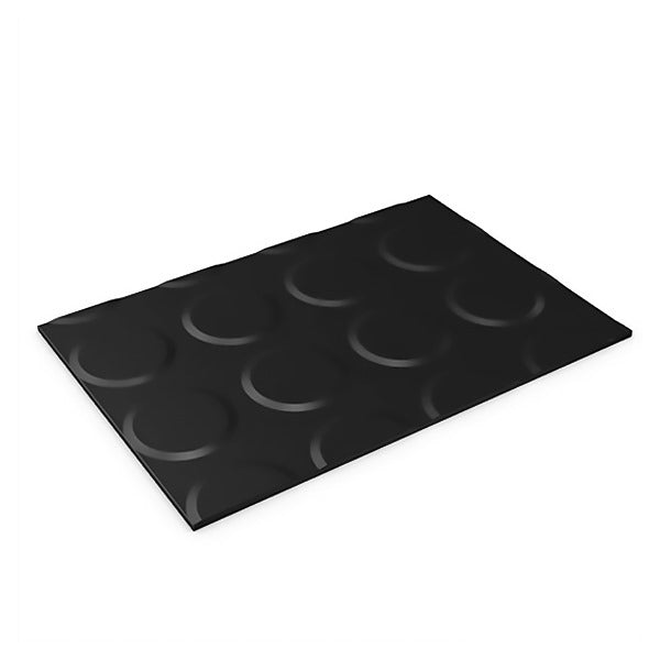 Angled view of a black, rectangular rubber mat with a raised, non-slip circular coin pattern.