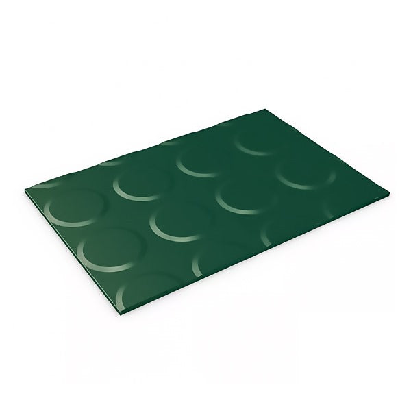 Angled view of a dark green, rectangular rubber mat with a raised, non-slip circular coin pattern.