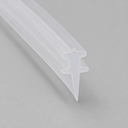 Clear winged T-seal with a slender pointed tail, diagonal studio shot on grey.