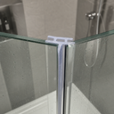 Clear T-seal outlined in blue, fitted at the corner post of a wet glass shower enclosure.