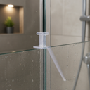 Clear T-seal fitted vertically along a glass shower door edge, unhighlighted view.