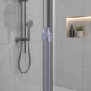 Clear seal fitted vertically in a shower enclosure, a handheld shower head visible alongside.