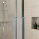 Two clear ribbed channel seals running down the meeting edges of glass shower panels