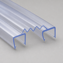 Cut end of clear twin U-channel seal with a zigzag ridged top, on a grey background