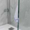 Blue-outlined seal fitted at a glass shower corner where two panels meet.