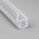 Clear chair-shaped seal with a circular loop foot, diagonal studio shot on grey.