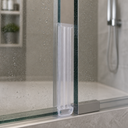 Clear ribbed seal fitted vertically along a glass frame edge, near the shower tray.