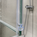 Clear T-seal fitted along a green-tinted glass shower door edge, near the mixer tap.