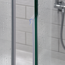 Lilac-highlighted T-hook seal fitted at a glass shower corner, niche shelf behind.