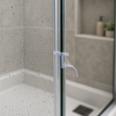 Clear seal fitted vertically along a glass shower frame edge, subtle and unhighlighted.
