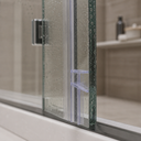 Clear seal fitted vertically between glass shower panels, tiled corner behind.