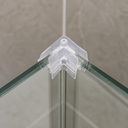 Small clear corner piece clipped to the top corner of a glass shower screen, screw hole on top face