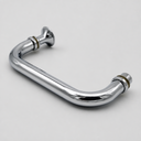 Polished chrome D-pull shower door handle angled on white, brass washers at both mounting posts