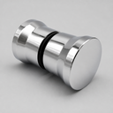 Back-to-back chrome shower door knob on pale grey, angled view showing the black rubber seal