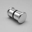 Polished chrome back-to-back shower knob on a grey background, black seal ring at its centre
