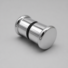 Polished chrome back-to-back shower knob on a grey background, black seal ring at its centre