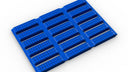 3D render of blue modular matting with a grid and raised slat surface, on white.